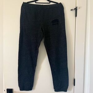 Dark wash Root’s original sweatpants.